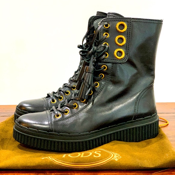 Tod’s leather mid-calf combat boots.
